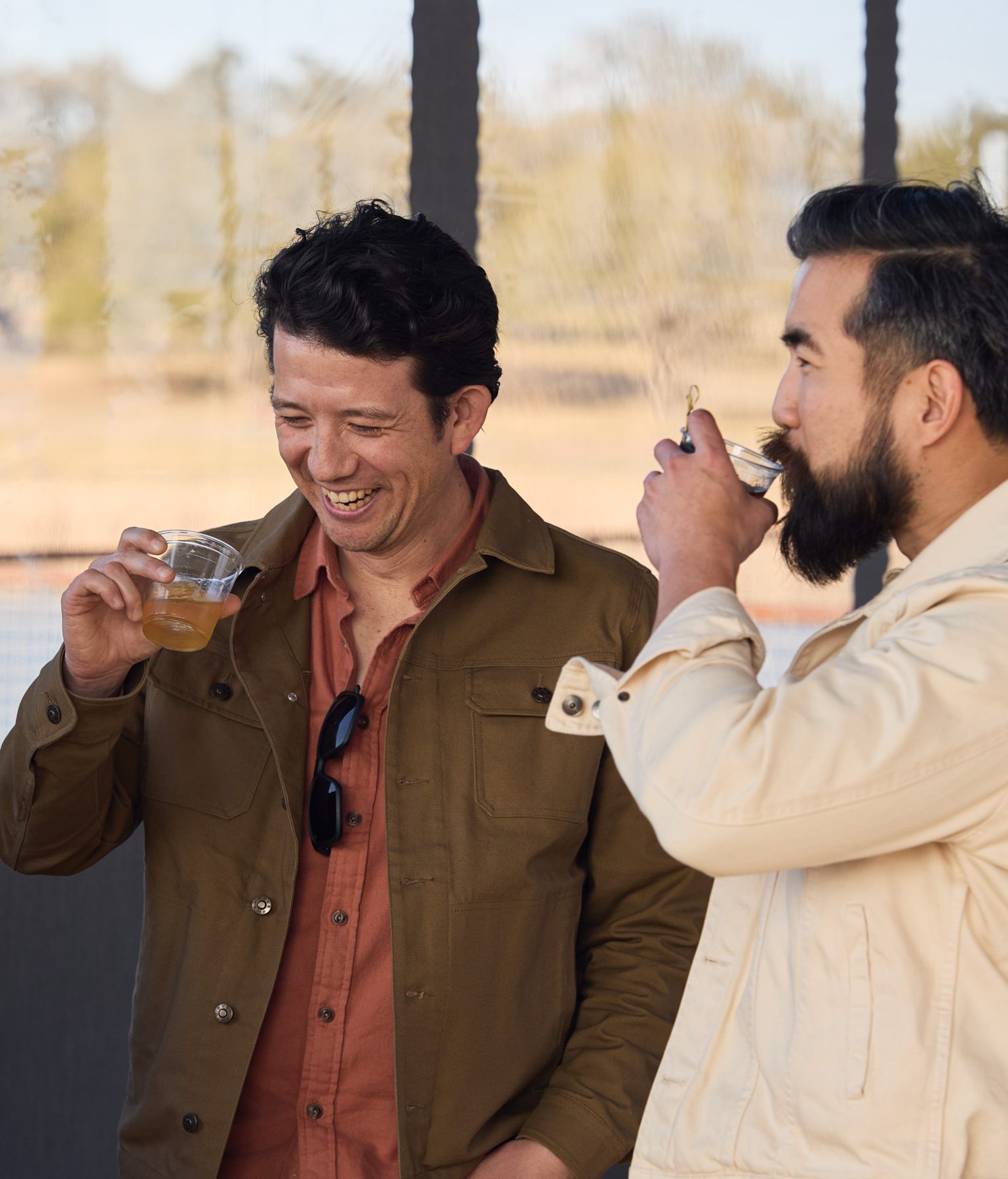 Guests enjoying drinks by the lake