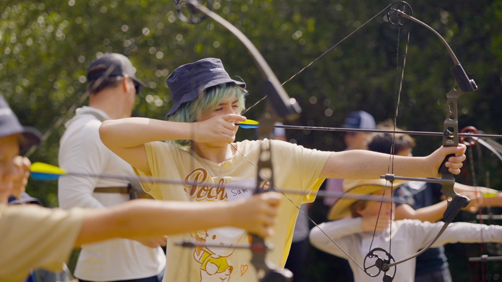 Students at full draw during an archery session